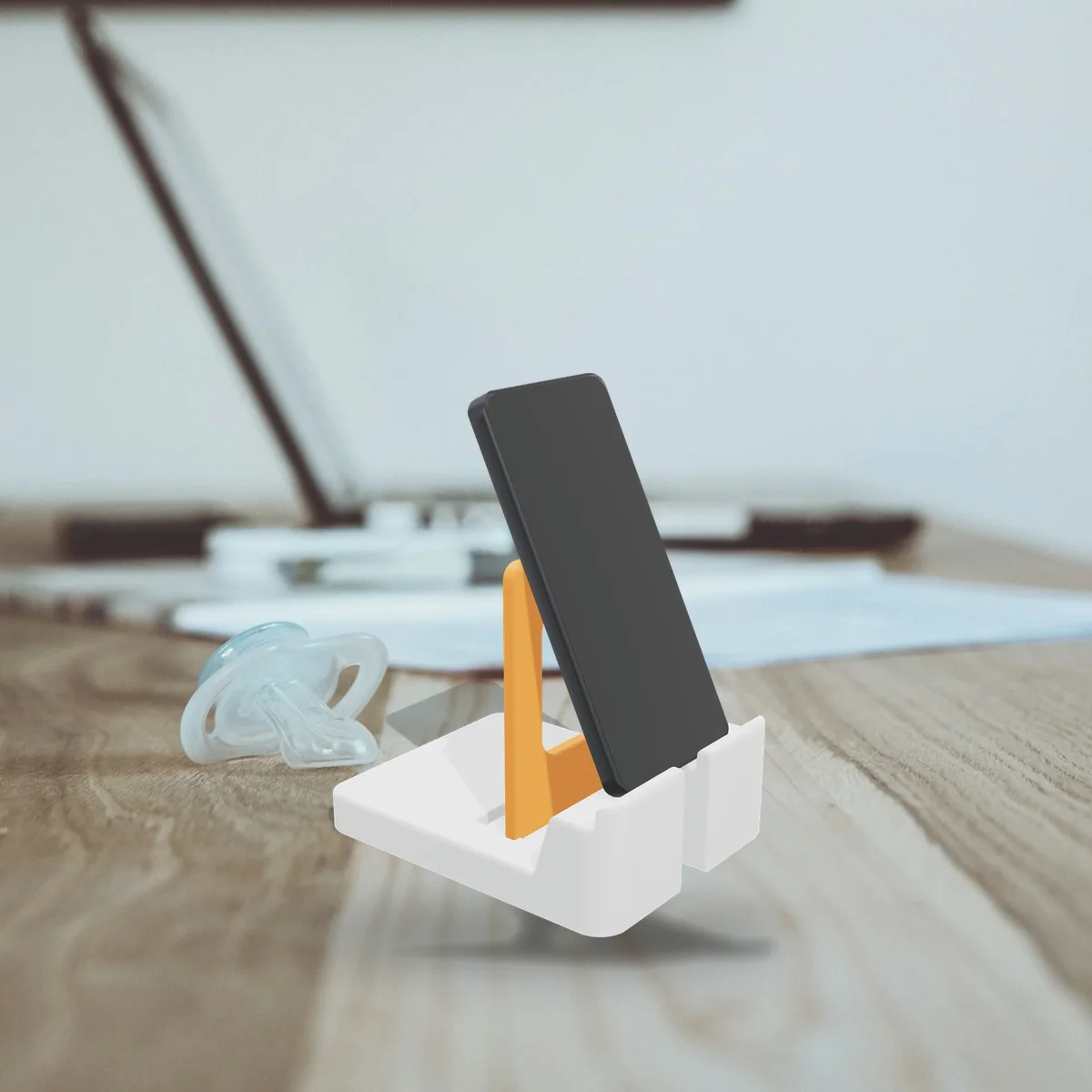 The Phone & Tablet Stand in a room (a 3D render of the model placed in a photo)