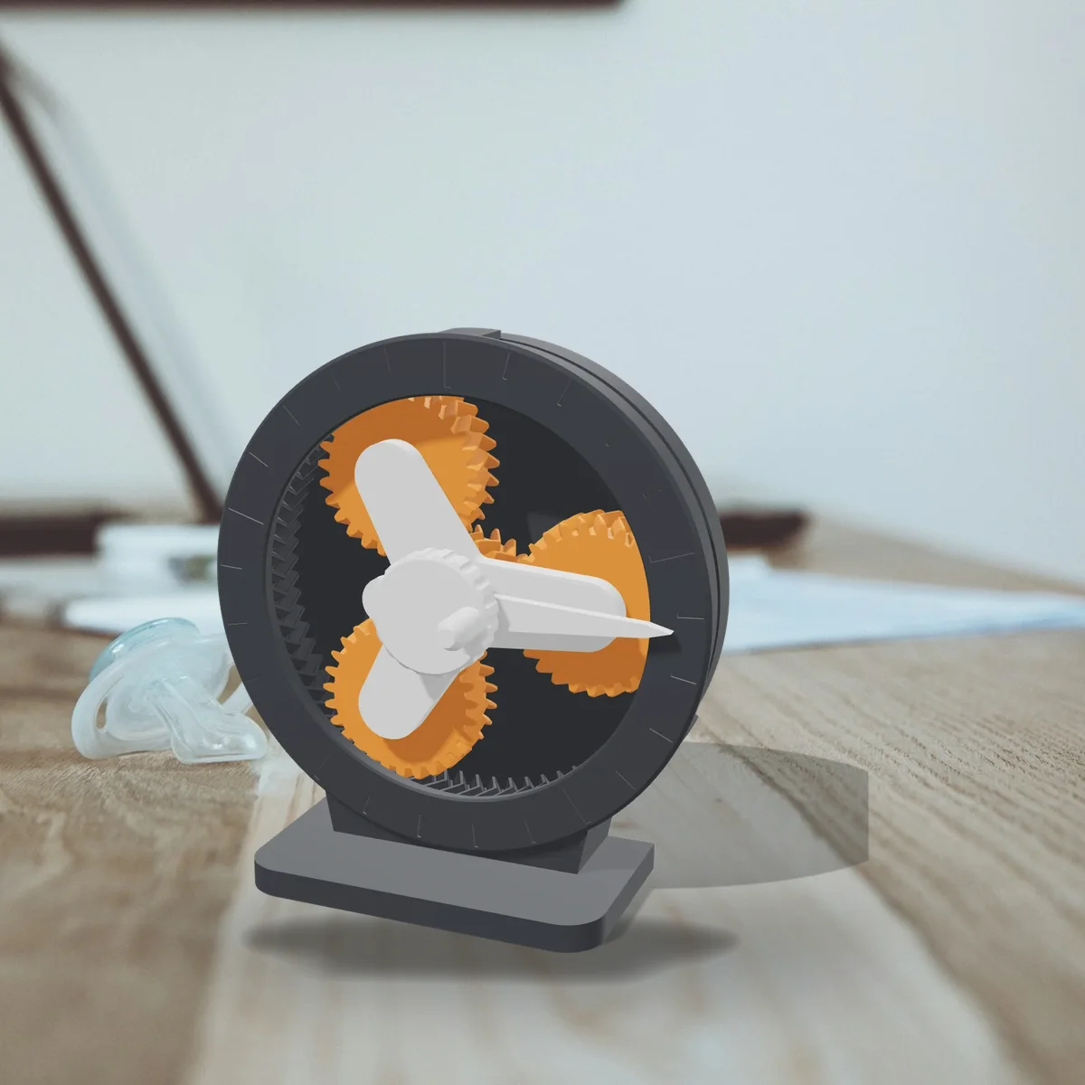 The Planetary Gear Desk Toy in a room (a 3D render of the model placed in a photo)